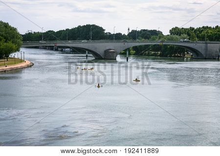 Rhone River With Bridge And Canoes In Avignon City