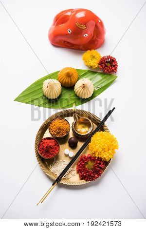 A modak is an Indian sweet dumpling popular in many parts of India. It is called modak in Marathi and Konkani as well as Gujarati language, Kozhakkatta in Malayalam, modhaka or kadubu in Kannada