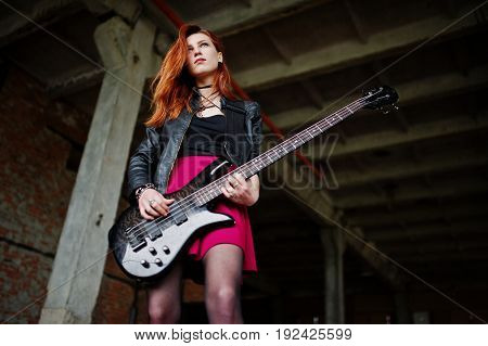Red Haired Punk Girl Wear On Black And Red Skirt, With Bass Guitar At Abadoned Place. Portrait Of Go