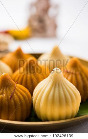 A modak is an Indian sweet dumpling popular in many parts of India. It is called modak in Marathi and Konkani as well as Gujarati language, Kozhakkatta in Malayalam, modhaka or kadubu in Kannada