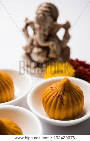 A modak is an Indian sweet dumpling popular in many parts of India. It is called modak in Marathi and Konkani as well as Gujarati language, Kozhakkatta in Malayalam, modhaka or kadubu in Kannada