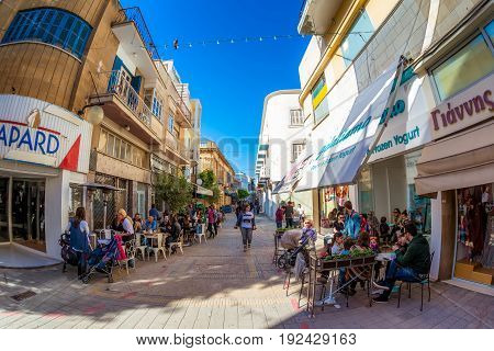 Nicosia Cyprus - April 13 2015: People Side Walk Restaurants And Cafes On Onasagorou Street.