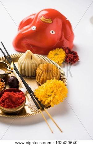 A modak is an Indian sweet dumpling popular in many parts of India. It is called modak in Marathi and Konkani as well as Gujarati language, Kozhakkatta in Malayalam, modhaka or kadubu in Kannada