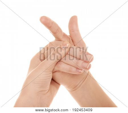 Hands of woman suffering from pain in joints on white background. Concept of orthopedist attendance