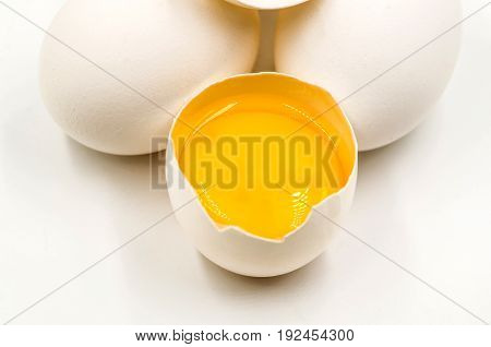 fresh eggs with yellow yalk on the black background