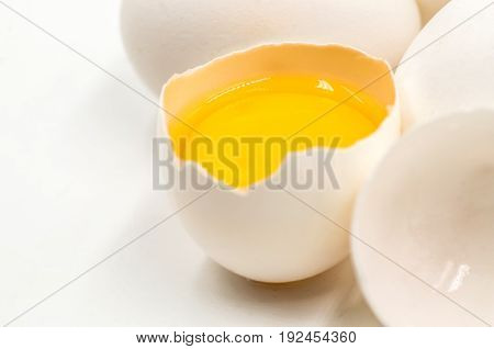 fresh eggs with yellow yalk on the white background