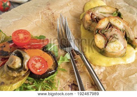 Roast rabbit meat with steamed vegetables and puree.