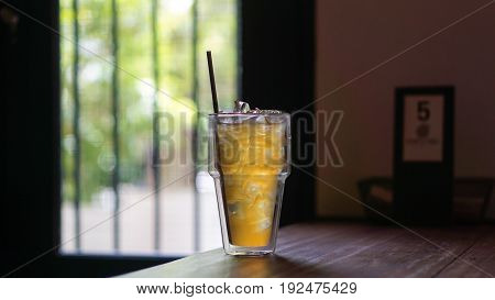 Lemon ice tea on the wood table.
