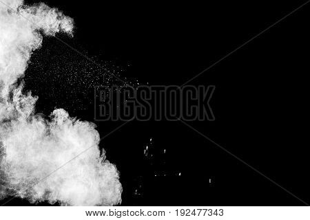 abstract white powder explosion on black background.