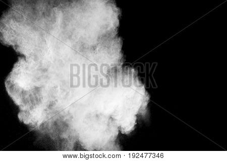 abstract white powder explosion on black background.