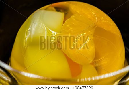 fruit jelly in a crystal bowl on black background