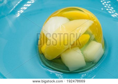 fruit various jelly mix on a blue plate
