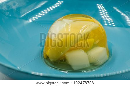 fruit various jelly mix on a blue plate