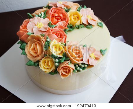 Birthday cake with flowers rose on white background.