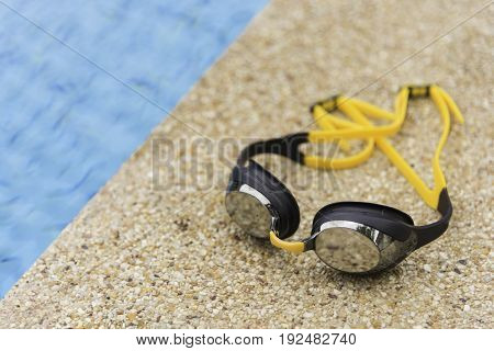 Goggles On The Side Of A Swimming Pool