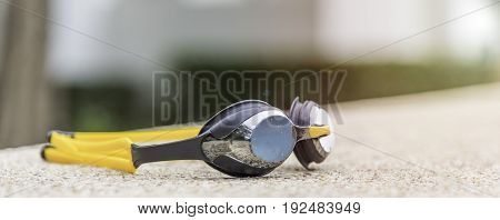 Goggles On The Side Of A Swimming Pool