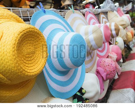 Summer hats sale at walking street market in Thailand