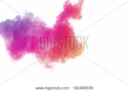 abstract multicolored powder splatted on white backgroundFreeze motion of color powder exploding