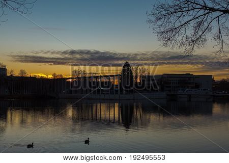 sundown above a lake in a park