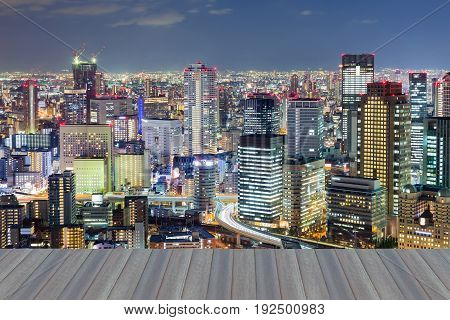 Opening wooden floor top view Osaka cental business downtown night view Japan