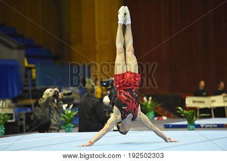 Kyiv. Ukraine-April 1 2017 : Male gymnast performing on stationary gymnasic rings during Stella Zakharova Artistic Gymnastics Cup