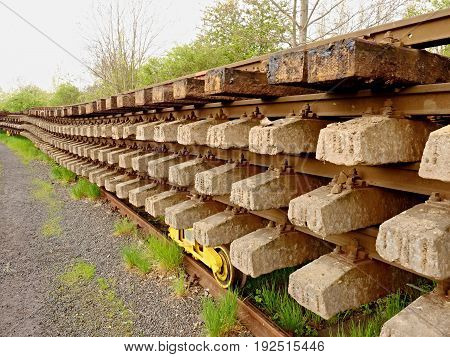 Wagon With Extracted Old Railways. Concrete And Wooden Sleepers With Rail Rods
