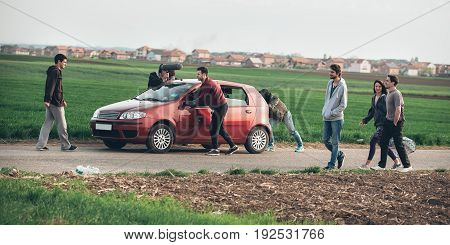 Behind Scene Improvisation. Film Crew Team Pushing Car With Cameraman