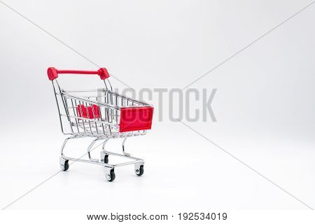 the miniature shopping cart isolated on background