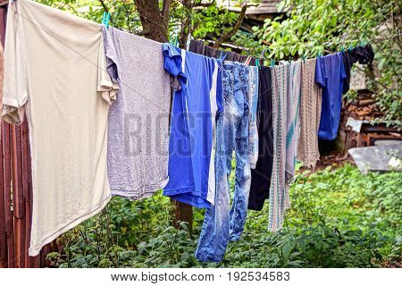 Clothing and linen dries after washing in the yard