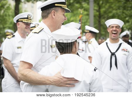 ADM Phil Davidson, CDR US Fleet Forces Command, poses for photographs with sailors at the re-enlistment and promotion ceremony on the National Sept 11 Memorial site. Fleet Week, NEW YORK MAY 26 2017