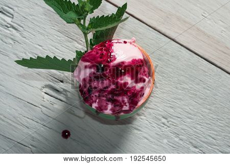Homemade Rose Ice Cream And A Sprig Of Mint In A Cup,