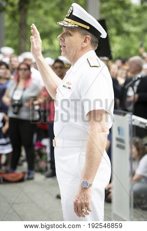 Admiral Phil Davidson, Commander US Fleet Forces Command, swears in military personnel at the re-enlistment and promotion ceremony on the National Sept 11 Memorial site Fleet Week NEW YORK MAY 26 2017