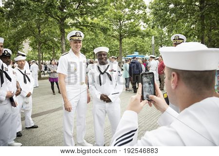 ADM Phil Davidson, CDR US Fleet Forces Command, poses for photographs with sailors at the re-enlistment and promotion ceremony on the National Sept 11 Memorial site. Fleet Week, NEW YORK MAY 26 2017
