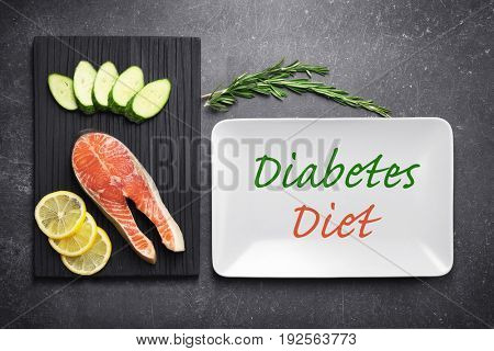 Text DIABETES DIET and healthy food on gray background. Health care concept