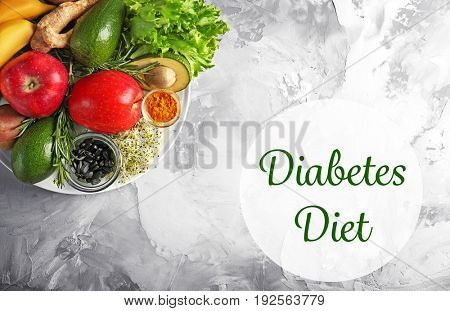 Text DIABETES DIET and healthy food on textured background. Health care concept
