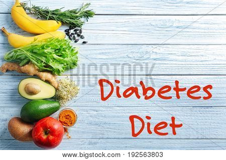 Text DIABETES DIET and healthy food on wooden background. Health care concept