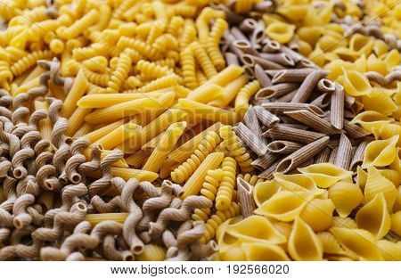 noodles pasta of different kinds scattered on the table.