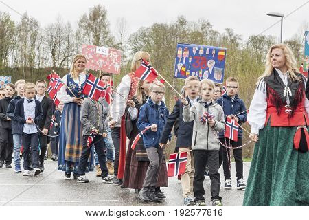 VERDAL NORWAY - MAY 17 2017: National day in Norway. Norwegians at traditional celebration and parade on may 17 2017 in Verdal. People on parde before school in Verdal. Constitution Day is the National Day of Norway.