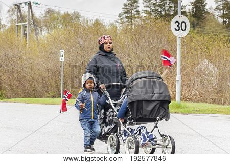 VERDAL NORWAY - MAY 17 2017: National day in Norway. Norwegians at traditional celebration and parade on may 17 2017 in Verdal. People on parde before school in Verdal. Constitution Day is the National Day of Norway.
