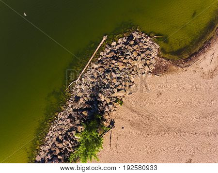 Aerial view of ocean beach. Sand beach and sea view from above. Beach aerial view of ocean water and sand shore. Aerial shot of beach