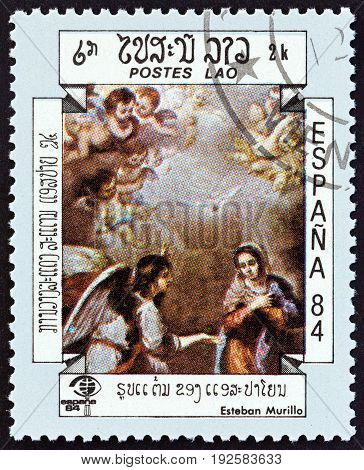 LAOS - CIRCA 1984: A stamp printed in Laos from the "International Stamp Exhibition Espana '84, Madrid, Spain " issue shows The Annunciation (Esteban Murillo), circa 1984.