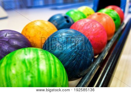 A colorful bowling balls in return machine