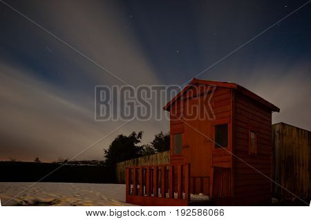Long exposure of a garden shed on a cloudy starry in Donegal.