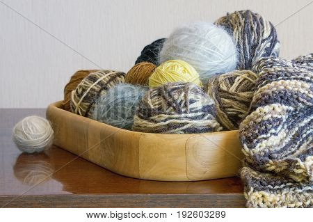 Balls of wool for knitting on the table