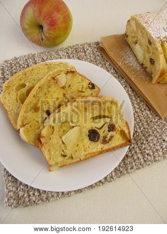Sponge cake with apple pieces and raisins