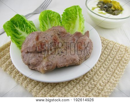 Bio neck steak with salad and caper sauce