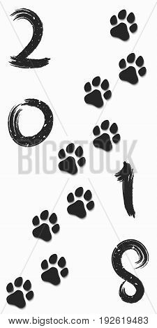 2018 year of the dog. Figures in the grunge style. Traces of a dog in black on a white background. Soft shadow. Vector illustration. EPS 10