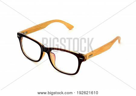 vintage dark brown wooden glasses isolated on white background