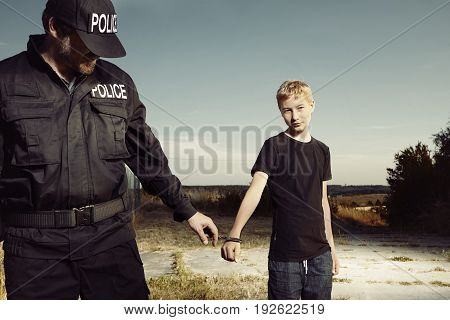 Teenager taken to handcuffs by police man