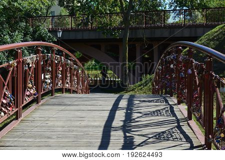 The bridge in the park Grodno hung with hundreds of locks symbolizing oath of eternal love and fidelity of the young couple